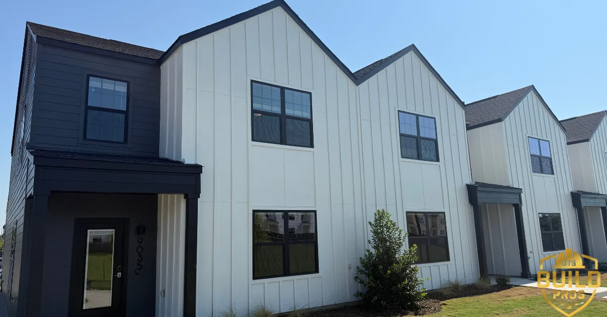 Completed multifamily townhome exteriors with board-and-batten siding and gabled roofs, built by UTS BuildPros